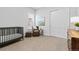 Bedroom featuring a crib, shuttered window and closet at 11412 Autumn Moon St, Littleton, CO 80125