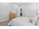Bedroom with bed, dresser, closet and light-toned walls at 11412 Autumn Moon St, Littleton, CO 80125