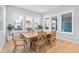 Beautiful dining room featuring wood floors, a wood table, and many windows at 11412 Autumn Moon St, Littleton, CO 80125