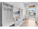 Bright entryway with a built-in bench, storage, and a view of the exterior at 11412 Autumn Moon St, Littleton, CO 80125