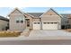 Attractive home with stone accents, two-car garage, and low-maintenance landscaping at 11412 Autumn Moon St, Littleton, CO 80125