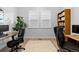 Home office space featuring a large bookshelf and two workstations at 11412 Autumn Moon St, Littleton, CO 80125