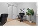 Home office featuring modern workstation and sliding barn door at 11412 Autumn Moon St, Littleton, CO 80125