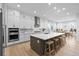 Contemporary kitchen with a large island, modern appliances, and a bright dining area at 11412 Autumn Moon St, Littleton, CO 80125