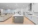 Spacious kitchen with an island, stainless appliances, and open layout to living area at 11412 Autumn Moon St, Littleton, CO 80125