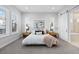 Serene main bedroom featuring a neutral palette, plush bedding, and natural light at 11412 Autumn Moon St, Littleton, CO 80125