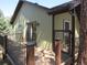 View of the deck with sliding glass doors and railing at 23136 Kiowa Rd, Indian Hills, CO 80454