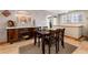 Dining room featuring hardwood floors and stylish wood cabinetry at 23136 Kiowa Rd, Indian Hills, CO 80454