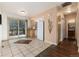 Dining room with tile floors and access to the deck at 23136 Kiowa Rd, Indian Hills, CO 80454