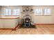 Cozy living area showcasing a charming fireplace and natural light from windows at 23136 Kiowa Rd, Indian Hills, CO 80454