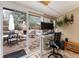 Sunroom office space with patio view, perfect for working from home at 23136 Kiowa Rd, Indian Hills, CO 80454