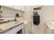 Laundry room featuring a utility sink, washer and dryer, and ample storage space at 23136 Kiowa Rd, Indian Hills, CO 80454