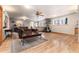 Spacious living room with hardwood floors, wood burning stove, and natural light at 23136 Kiowa Rd, Indian Hills, CO 80454