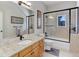 Bathroom with granite countertop, shower/tub combo at 334 Humphrey Dr, Evergreen, CO 80439