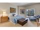 Primary bedroom with sitting area and access to patio at 334 Humphrey Dr, Evergreen, CO 80439