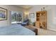 Bedroom with sitting area, deck access, and built-ins at 334 Humphrey Dr, Evergreen, CO 80439