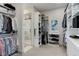 Large walk-in closet with custom shelving and a shower at 334 Humphrey Dr, Evergreen, CO 80439