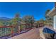Spacious deck with mountain views and built-in grill at 334 Humphrey Dr, Evergreen, CO 80439