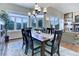 Spacious dining area with a wooden table and chairs, and views at 334 Humphrey Dr, Evergreen, CO 80439