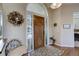 Bright and spacious entryway with hardwood floors and decorative wreath at 334 Humphrey Dr, Evergreen, CO 80439