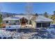 Mountain view home with a large yard and attached two-car garage at 334 Humphrey Dr, Evergreen, CO 80439
