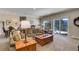 Bright Gathering room with comfortable seating and access to a deck with mountain views at 334 Humphrey Dr, Evergreen, CO 80439