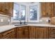 Kitchen corner with white quartz countertops and wood cabinets at 334 Humphrey Dr, Evergreen, CO 80439