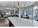 Bright kitchen features an island, breakfast area, and views of the surrounding area at 334 Humphrey Dr, Evergreen, CO 80439
