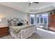 Spacious main bedroom with mountain views and private access to deck at 334 Humphrey Dr, Evergreen, CO 80439