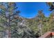 Deck view of mountain range and snow-capped peaks at 334 Humphrey Dr, Evergreen, CO 80439