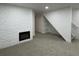 Finished basement with a fireplace and neutral carpeting at 14023 E Utah Cir, Aurora, CO 80012