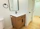 Modern bathroom with a floating vanity and updated fixtures at 14023 E Utah Cir, Aurora, CO 80012