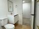 Contemporary bathroom with a floating vanity and gold fixtures at 14023 E Utah Cir, Aurora, CO 80012