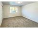 Spacious bedroom with neutral carpeting and large window at 14023 E Utah Cir, Aurora, CO 80012