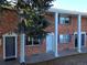 Front view of brick building with columns and landscaping at 14023 E Utah Cir, Aurora, CO 80012