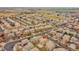 Aerial view showcases the home's location within a well-planned residential community with mature trees and landscaping at 15112 E 116Th Pl, Commerce City, CO 80603