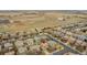 Aerial view showing the home situated in a suburban neighborhood with easy access to open land at 15112 E 116Th Pl, Commerce City, CO 80603