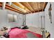 Unfinished basement space with exposed ceiling and a window offers potential for customization and added living area at 15112 E 116Th Pl, Commerce City, CO 80603