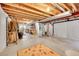 Spacious unfinished basement with exposed ceiling and utilities, providing ample storage and expansion possibilities at 15112 E 116Th Pl, Commerce City, CO 80603