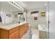 Bright and spacious bathroom with double sinks, a soaking tub, and ample counter space at 15112 E 116Th Pl, Commerce City, CO 80603