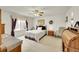 Charming bedroom with traditional furnishings, a floral quilt, and ample natural light at 15112 E 116Th Pl, Commerce City, CO 80603
