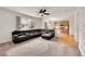 Open-concept living room seamlessly connects to the kitchen with ample natural light at 15112 E 116Th Pl, Commerce City, CO 80603