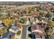 Aerial view of residential neighborhood with autumn foliage at 11854 Vallejo St, Denver, CO 80234