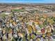 Aerial view of neighborhood with homes and a school in the distance at 11854 Vallejo St, Denver, CO 80234