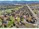 Aerial view of community near park, golf course, and main road at 11854 Vallejo St, Denver, CO 80234