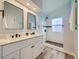 Modern bathroom with double vanity and walk-in shower at 11854 Vallejo St, Denver, CO 80234