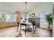 Modern dining room with fireplace and hardwood floors at 11854 Vallejo St, Denver, CO 80234