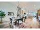 Dining area with chandelier and hardwood floors at 11854 Vallejo St, Denver, CO 80234