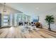 Bright living room with hardwood floors and large windows at 11854 Vallejo St, Denver, CO 80234