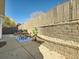 Private patio features a stone retaining wall and seating at 11854 Vallejo St, Denver, CO 80234